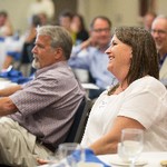 Audience members smiling